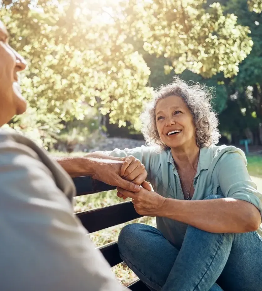 Happy elderly couple walking together on a sunny day